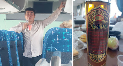A person standing next to a bottle of beer
Description automatically generated