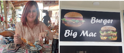 A person sitting at a table with a plate of food

Description automatically generated